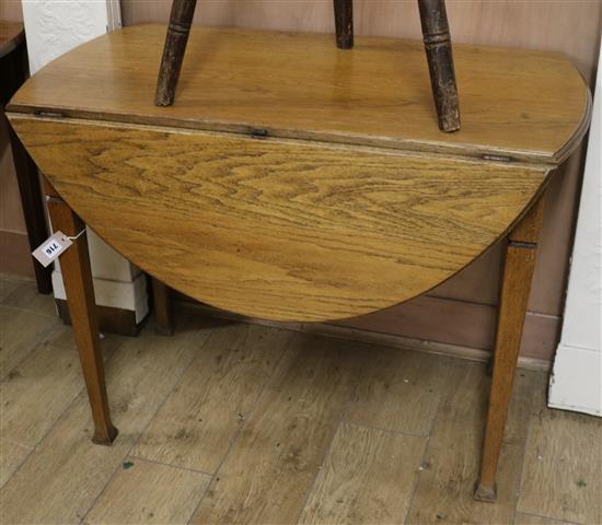 An oak oval topped Pembroke table 99cm